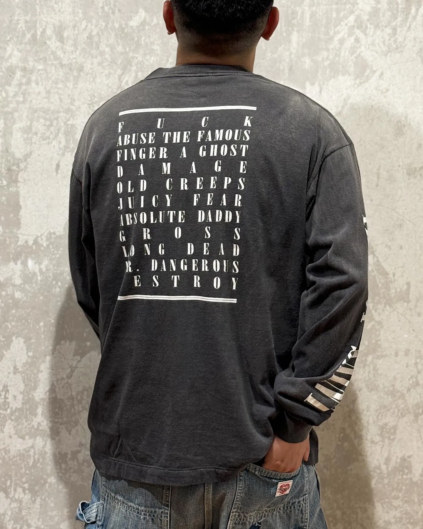 SAINT Mxxxxxx LS TEE/TEMPEST/BLK 'TEMPEST SAINT' Storm Religious Saints Cracked Retro Vulcanized Heavy Wash Long Sleeves Washed Black S-XL Assute Dyeing Multi-bit Horse Fading Craftsmanship Grinding and Hanging Holes Full of Old Feeling Top Printing Craftsmanship Purchasing Level